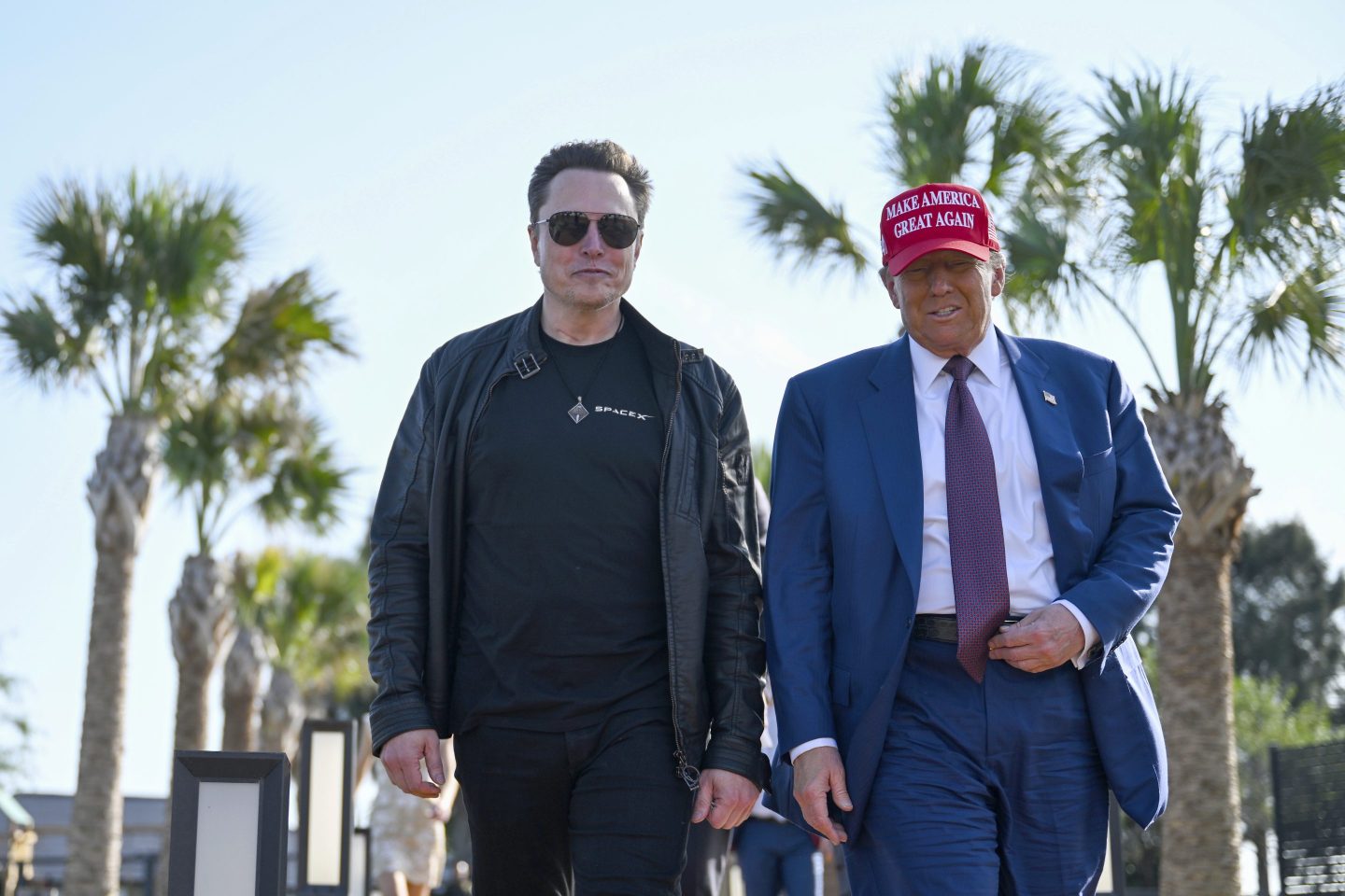 President-elect Donald Trump walks with Elon Musk before the launch of the sixth test flight of the SpaceX Starship rocket on Nov. 19, 2024 in Boca Chica, Texas.