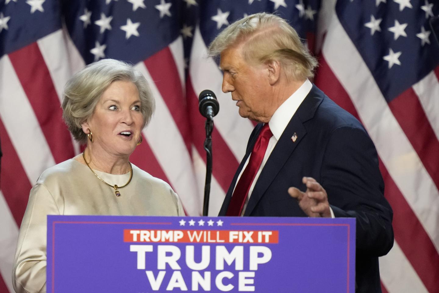 Republican presidential nominee former President Donald Trump brings Susie Wiles to the podium at an election night watch party.