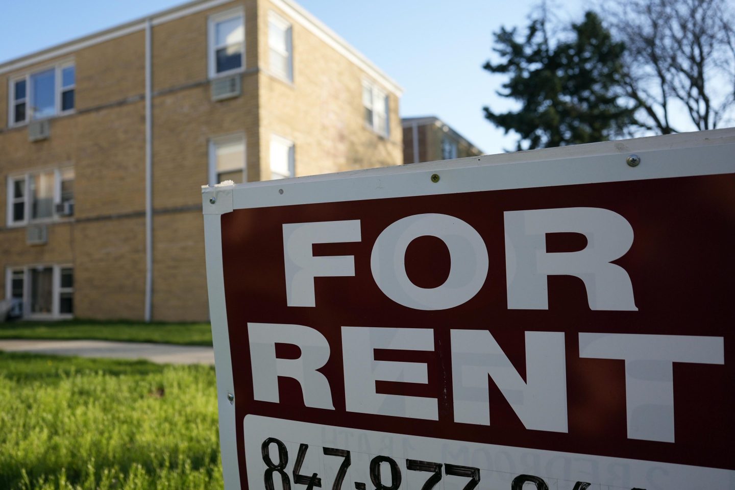 A sign is displayed outside an apartment building in Skokie, Ill., April 14, 2024.