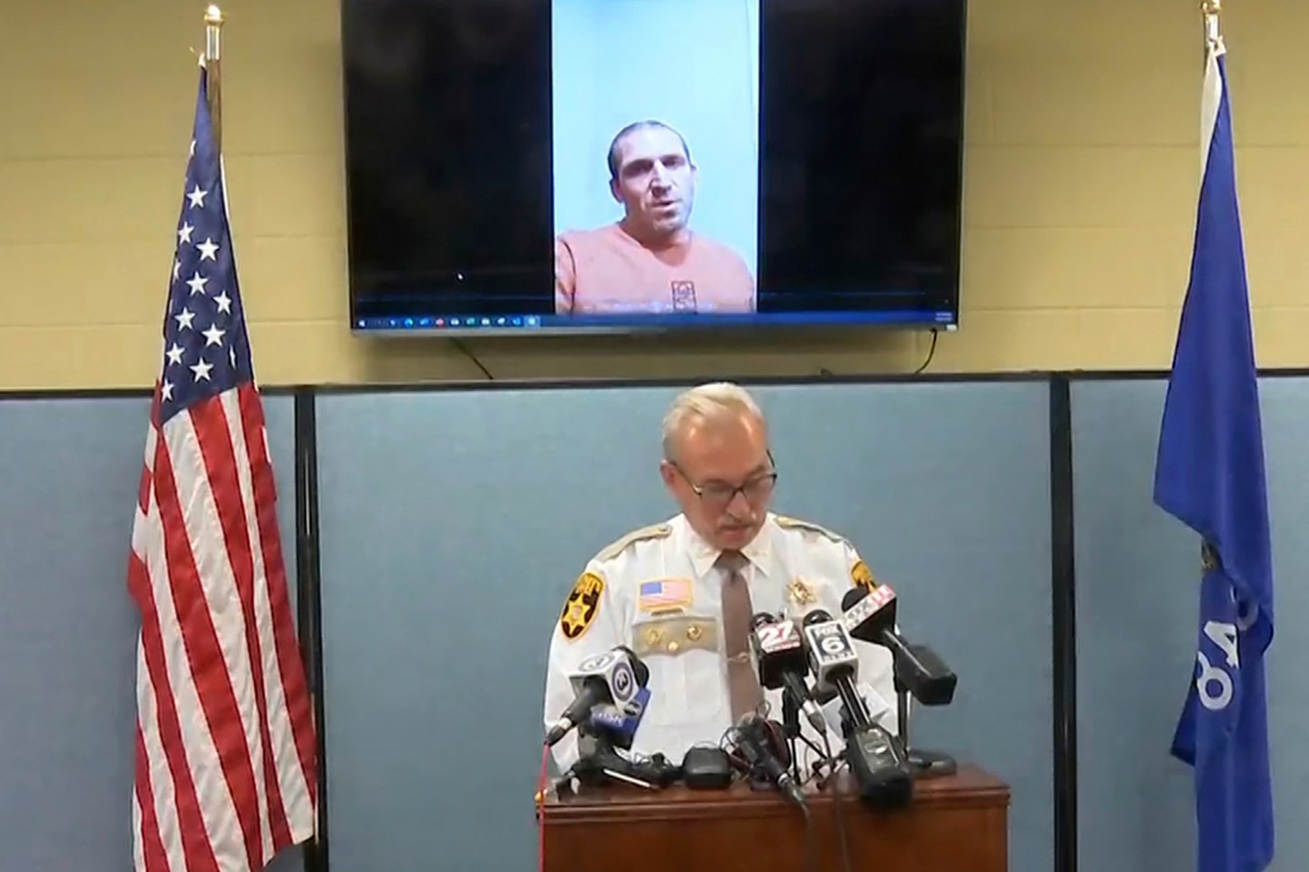 This still image provided by Green Lake County Sheriff's Office, Sheriff Mark Podoll holds a news conference regarding Ryan Borgwardt, who faked his own drowning this summer.