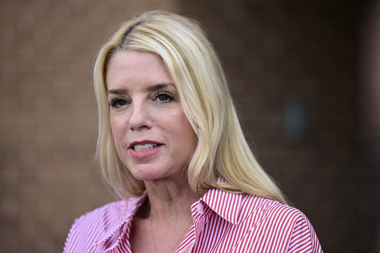 Pam Bondi, former Florida Attorney General, speaks to reporters outside an election integrity volunteer training, June 18, 2024, in Newtown, Pa.