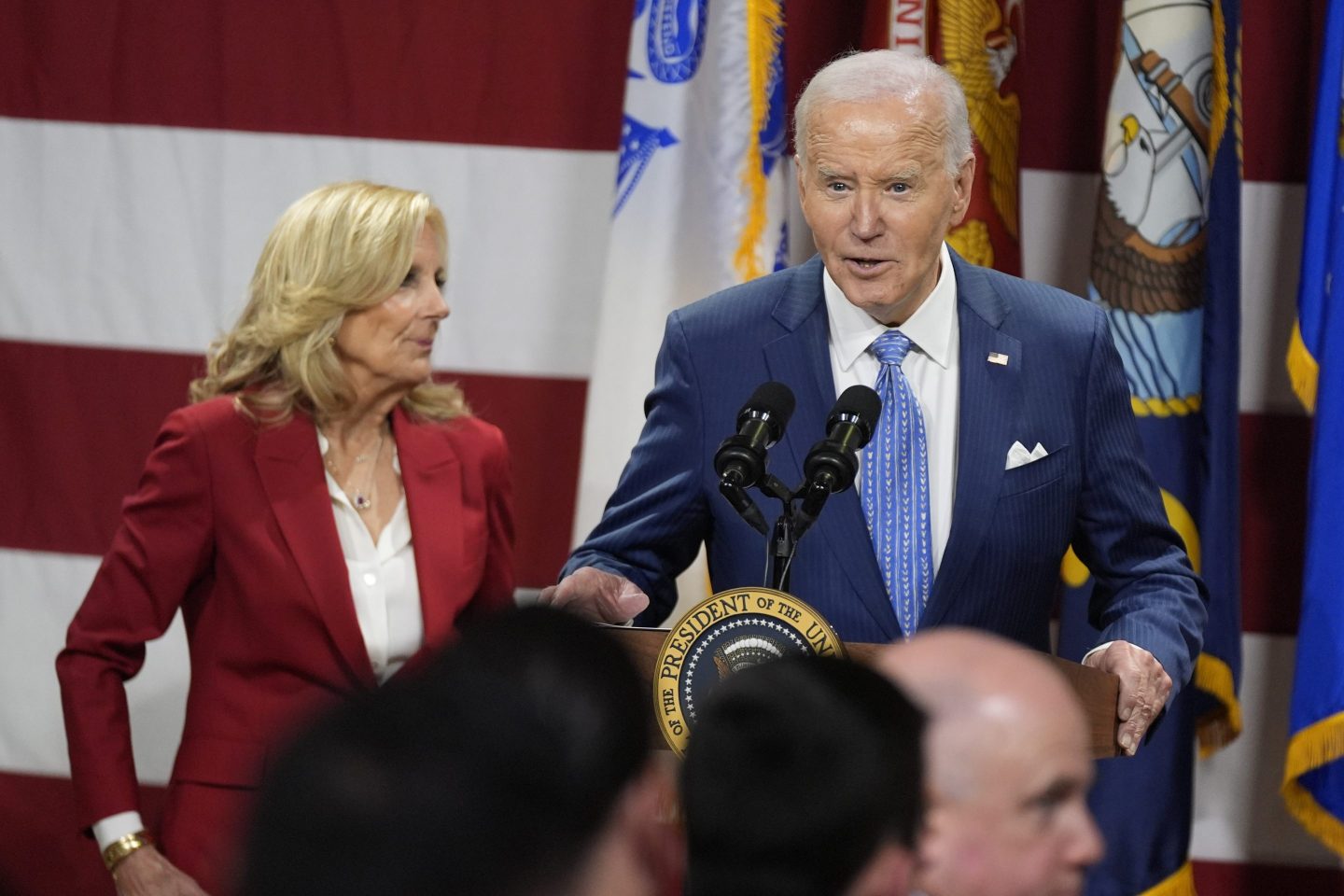 President Joe Biden speaks as first lady Jill Biden looks on at a Friendsgiving event with service members and their families in the Staten Island borough of New York, on Nov. 25 2024.