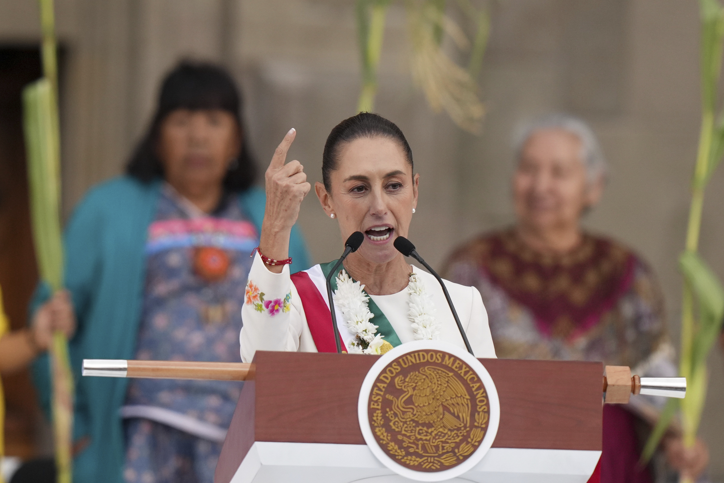 Newly-sworn in President Claudia Sheinbaum addresses supporters in the Zócalo, Mexico City's main square, on Oct. 1, 2024.