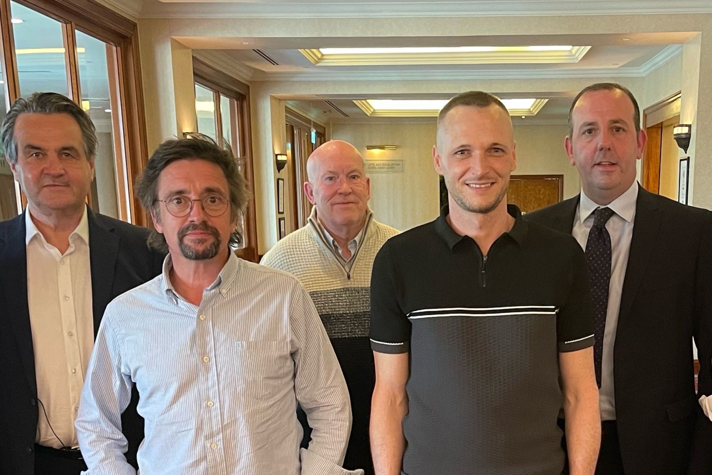 James Howells (front right) pictured with Top Gear presenter Richard Hammond (front left) when the pair met to discuss Howells's lost coins.