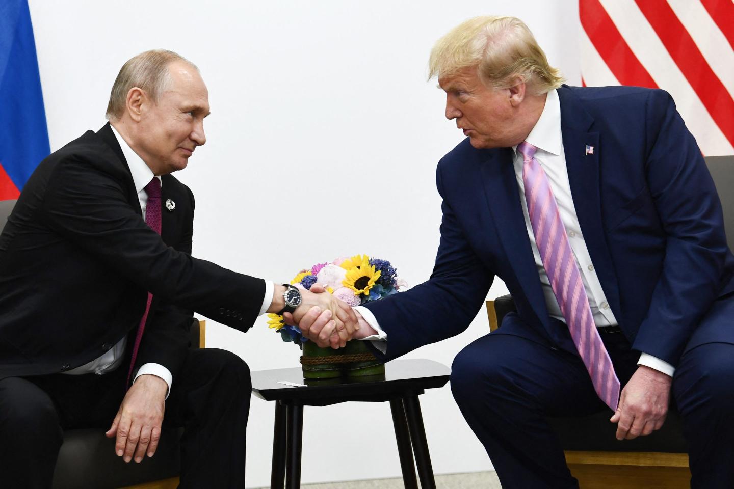 US President Donald Trump (R) attends a meeting with Russia's President Vladimir Putin during the G20 summit in Osaka on June 28, 2019.