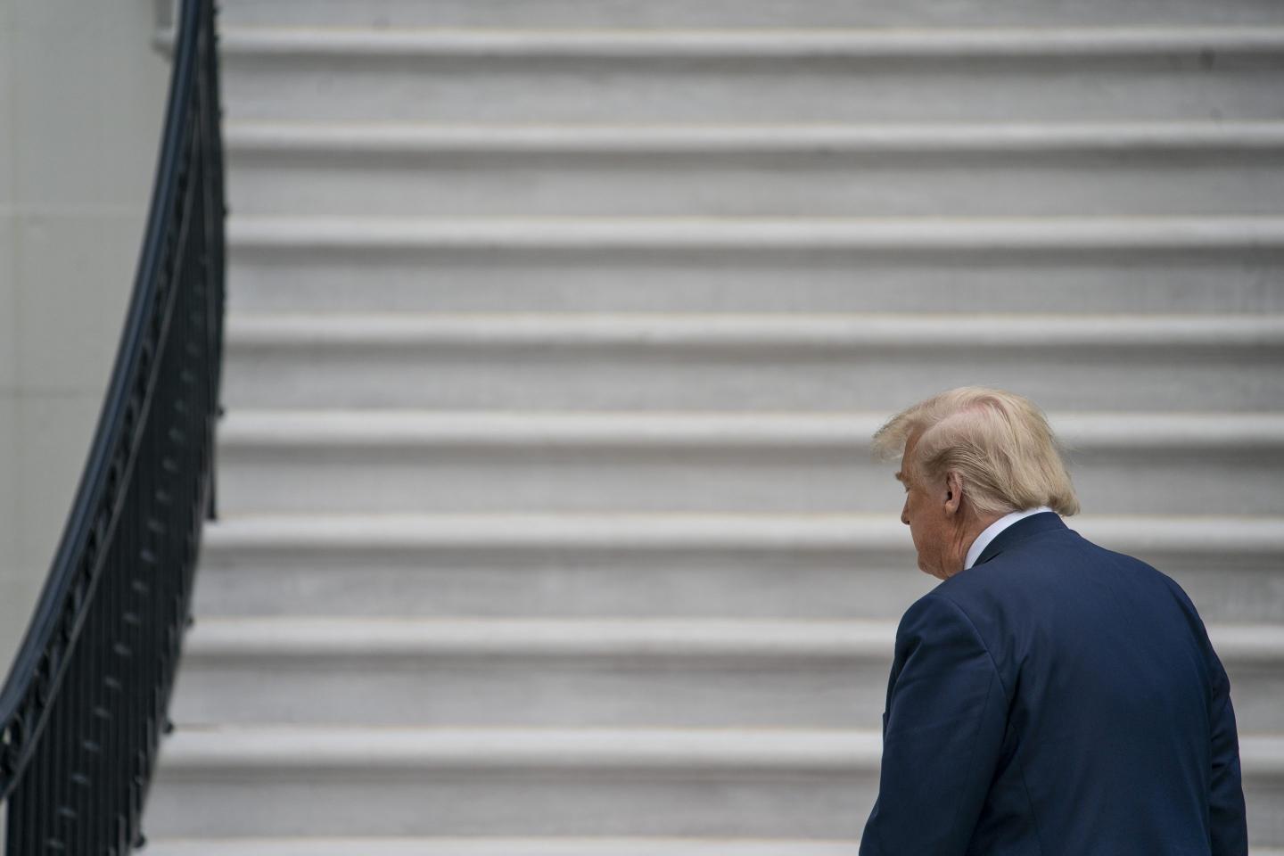 Donald Trump approaches the stairs of the the White House