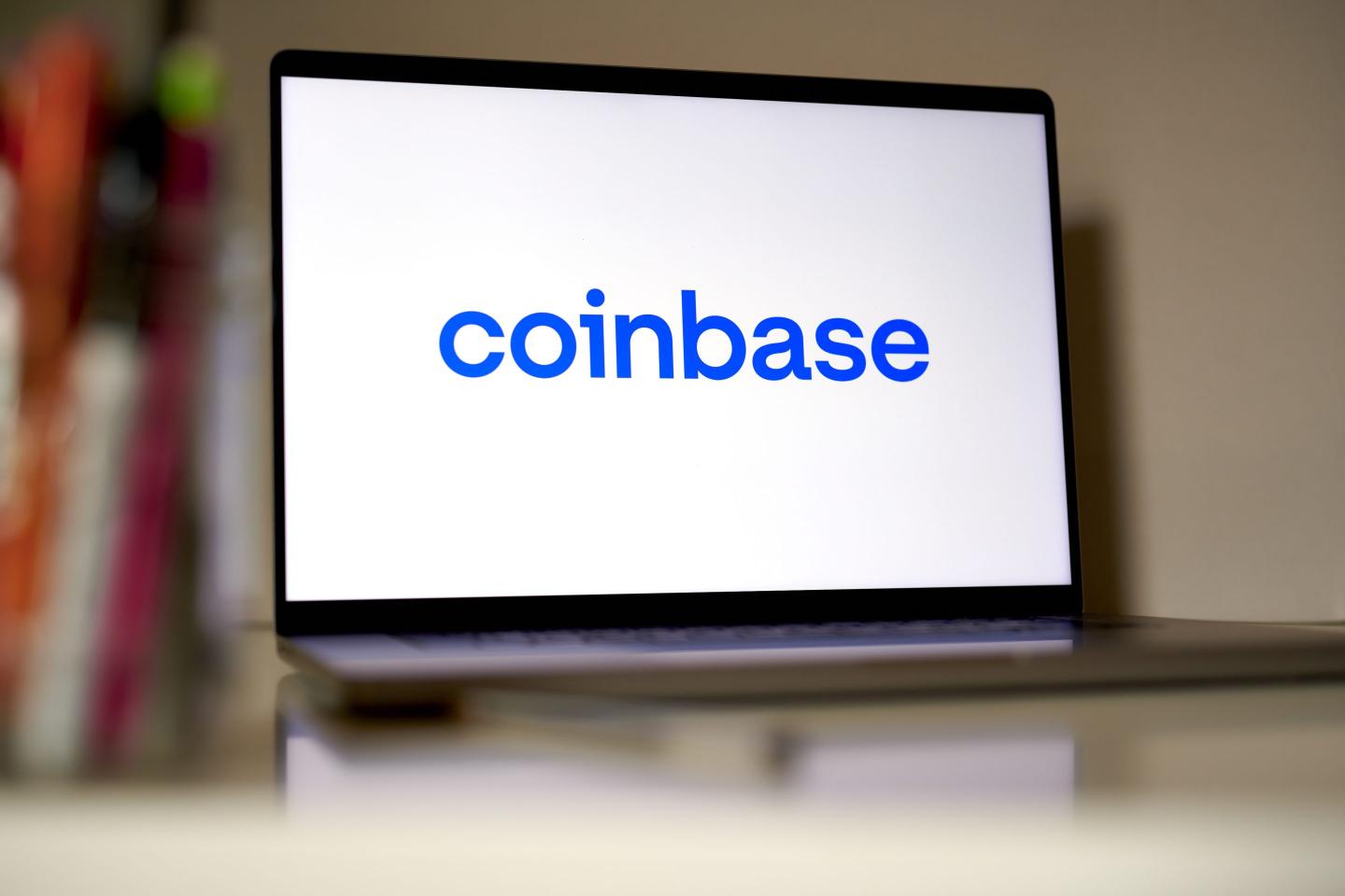 Coinbase logo on a laptop screen