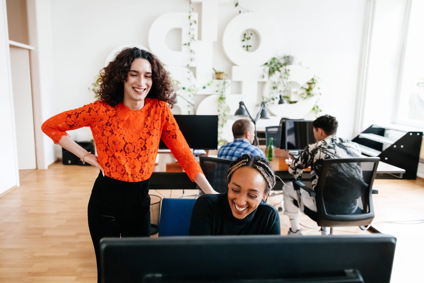 Manager talks with happy employee.