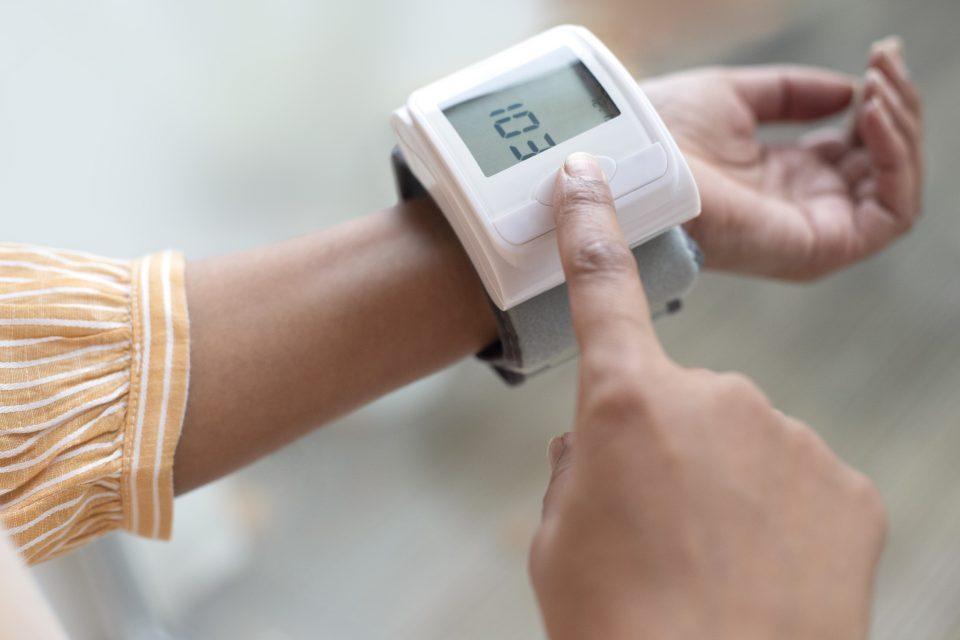 Woman checking her blood pressure