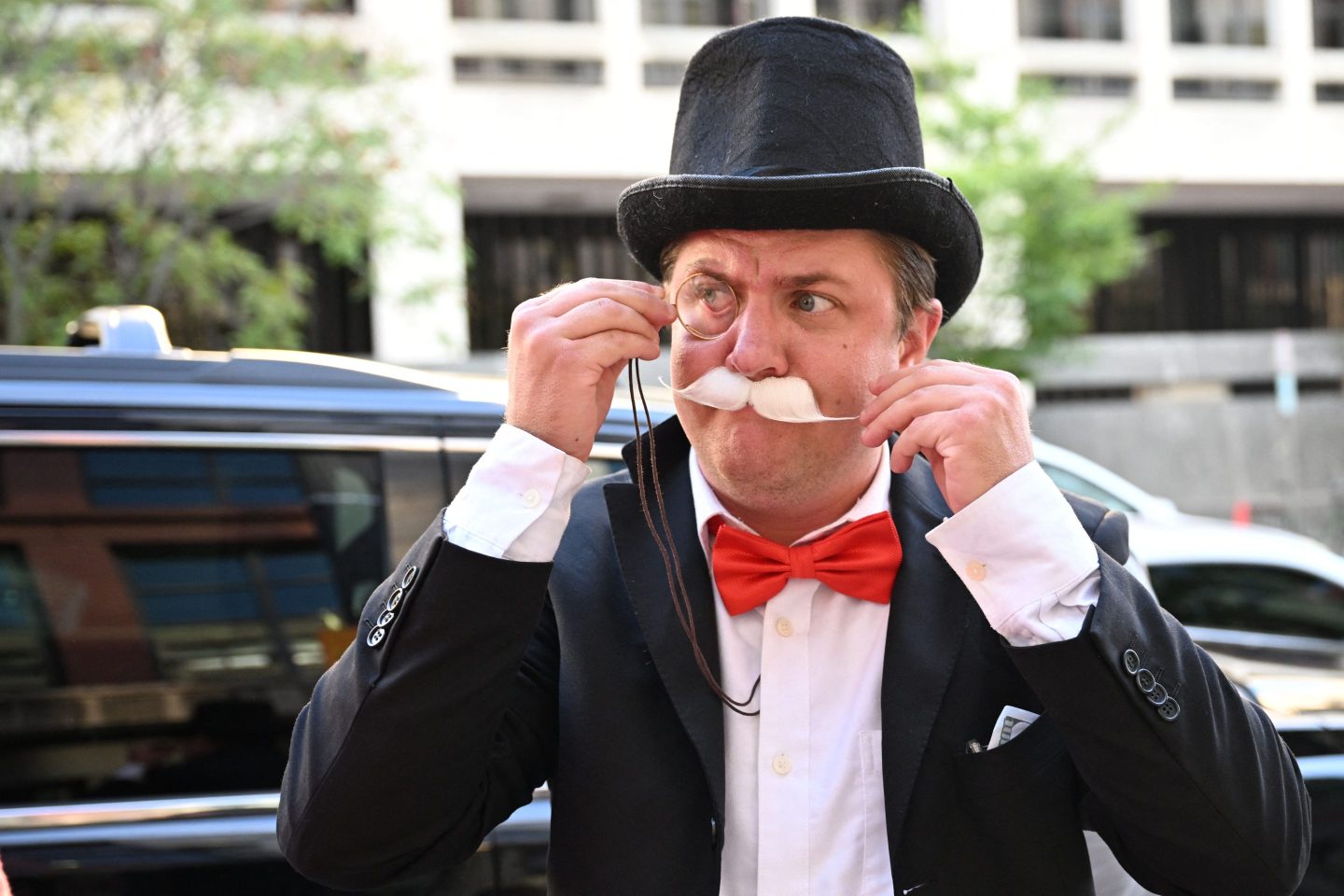 A man dressed as Monopoly board game character "Milburn Pennybags" is seen outside the E. Barrett Prettyman Courthouse in Washington, DC, on September 12, 2023. The landmark case pitting the U.S. government against Google over the dominance of the company's world-dominating search engine kicked off that day.