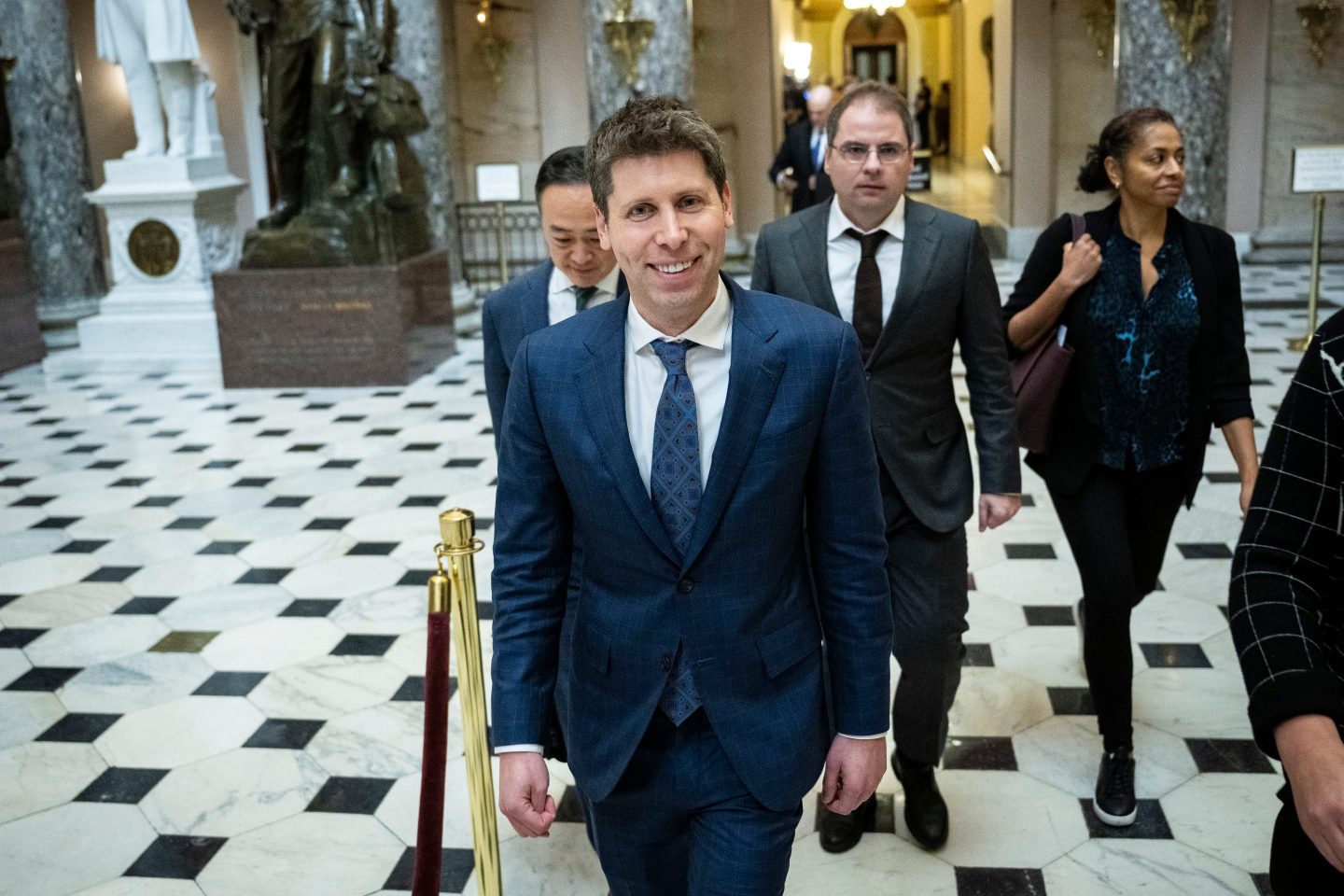 Sam Altman, CEO of OpenAI, in 2024 walking through a lobby after a meeting on Capitol Hill.