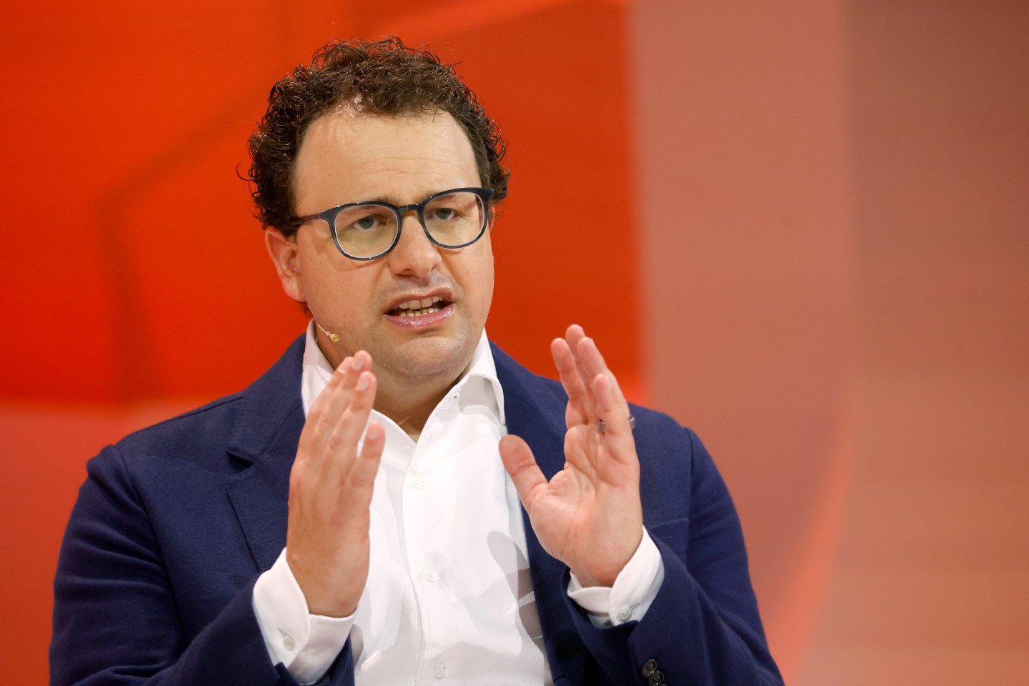 Anthropic CEO Dario Amodei on stage at a conference.