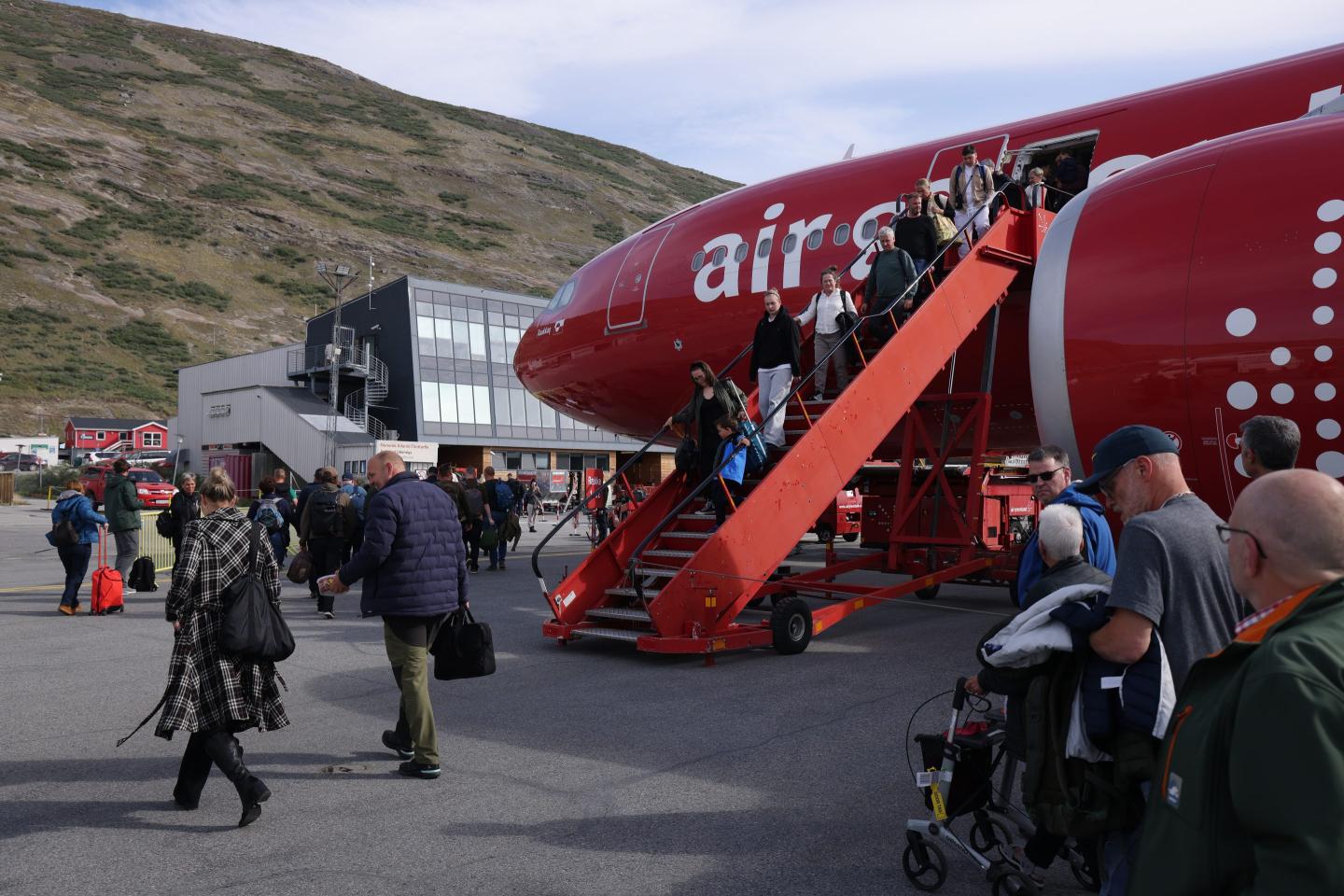 Endangered icebergs and melting glaciers are prompting the rise of ‘last-chance tourism’ in Greenland