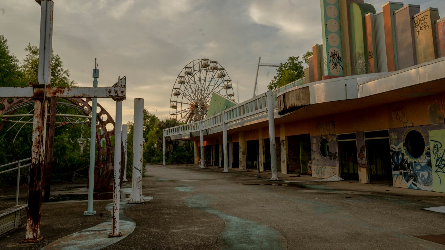 Rides and attractions sit empty inside the abandoned Six Flags Jazzland
