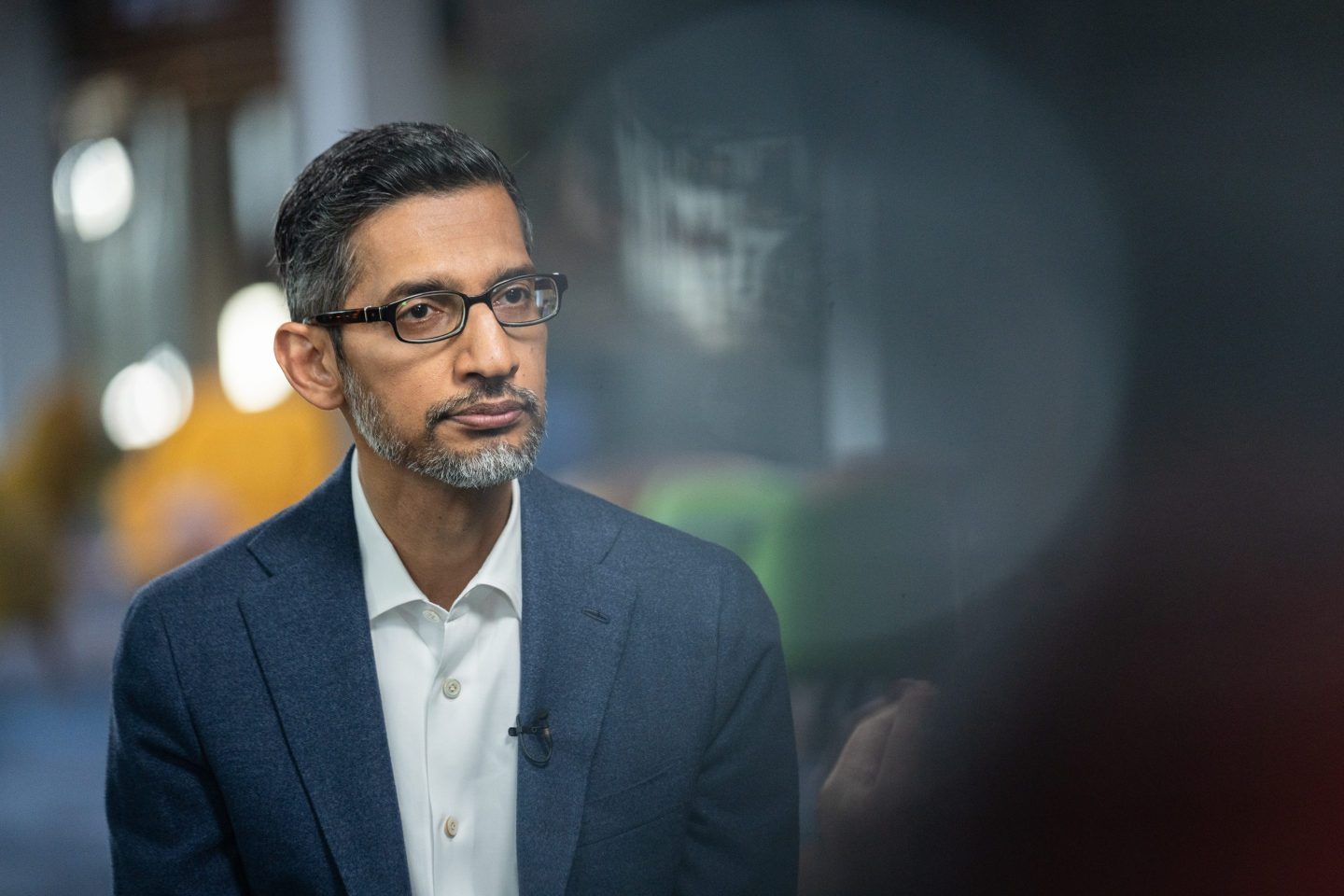 Sundar Pichai sits with a straight face.