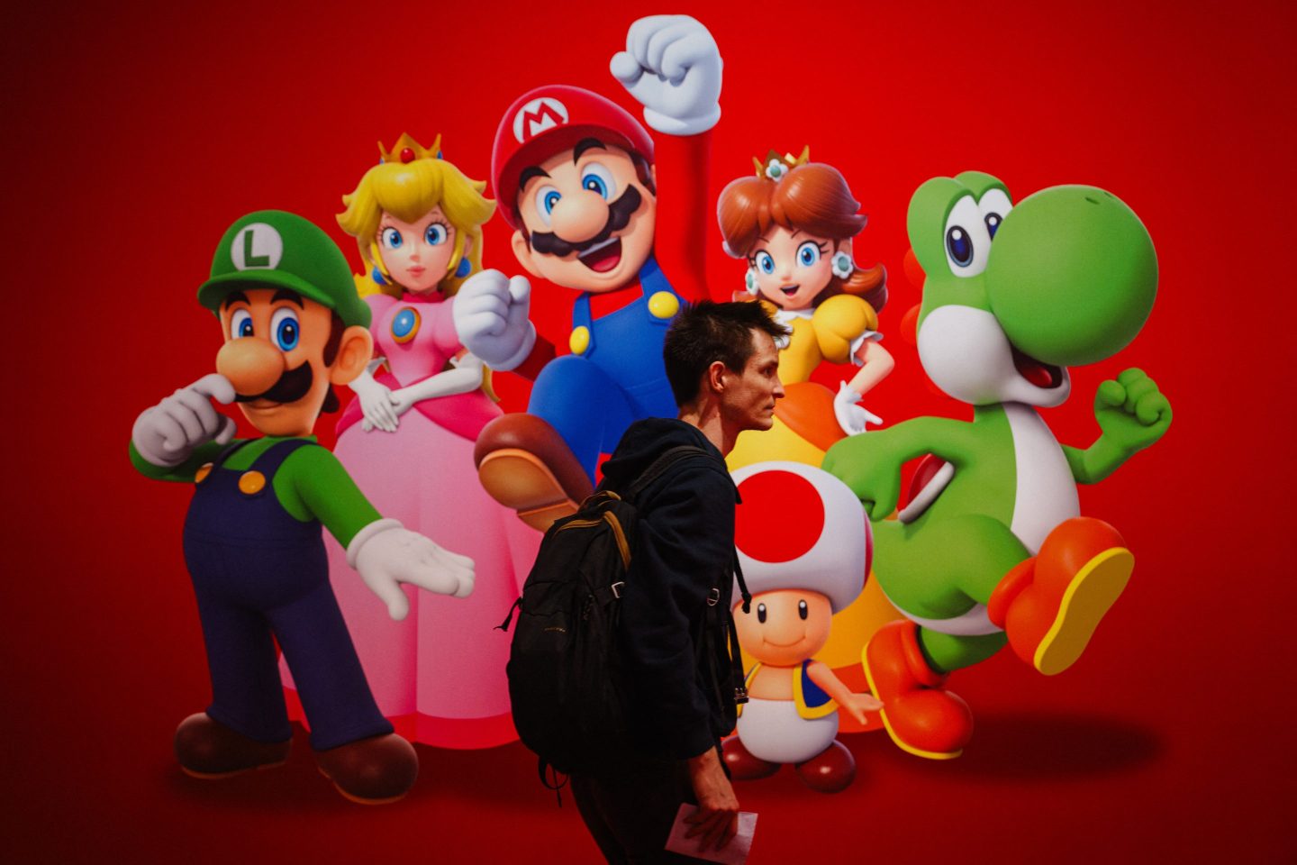 A visitor walks by "Super Mario" video-game poster by Nintendo during a press preview of the "Paris Games Week" fair in Paris, on Oct. 22, 2024.