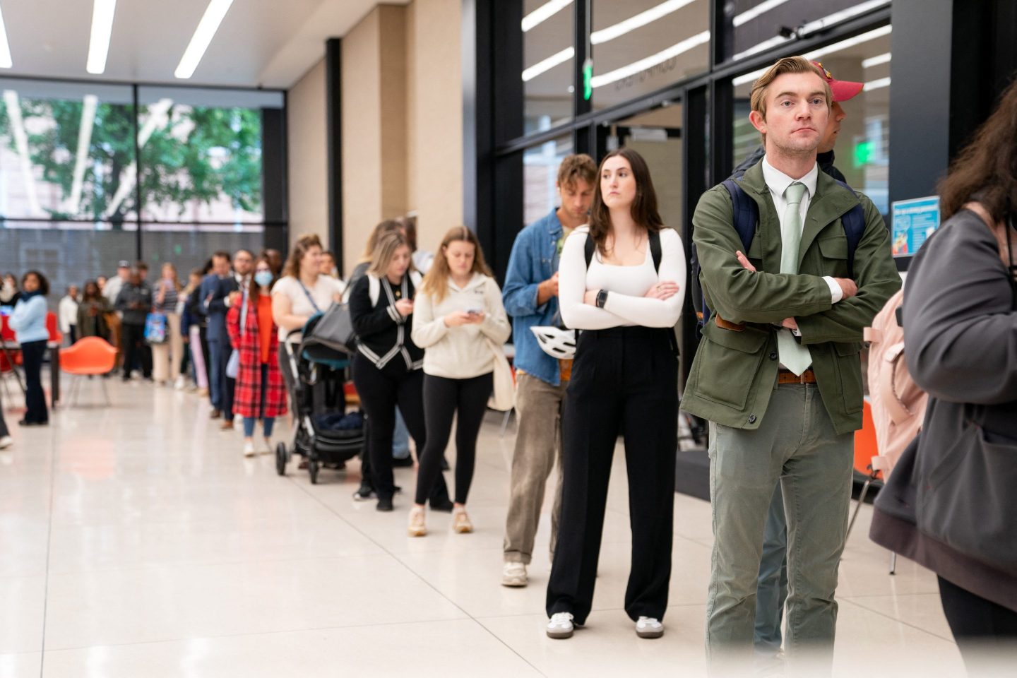 People wait in line to vote at a polling station in Washington, DC on Election Day.