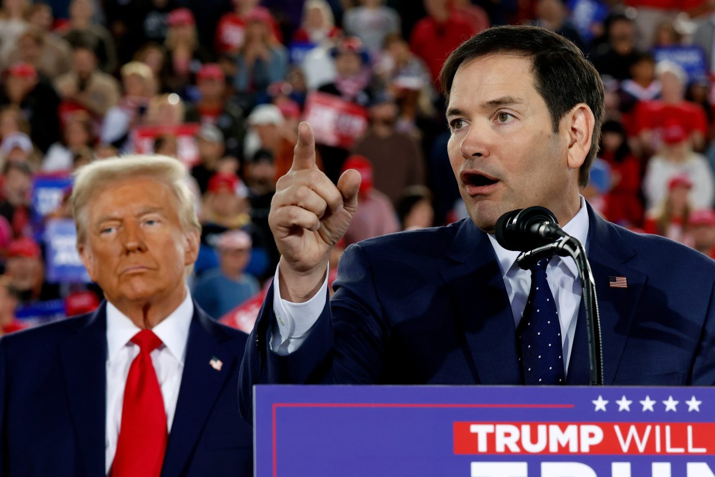 Then-Republican presidential nominee, former U.S. President Donald Trump watches as Sen. Marco Rubio (R-FL) speaks during a campaign rally at the J.S. Dorton Arena on Nov. 4, 2024 in Raleigh, N.C.