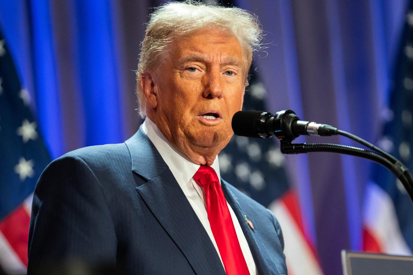 Donald Trump at a microphone