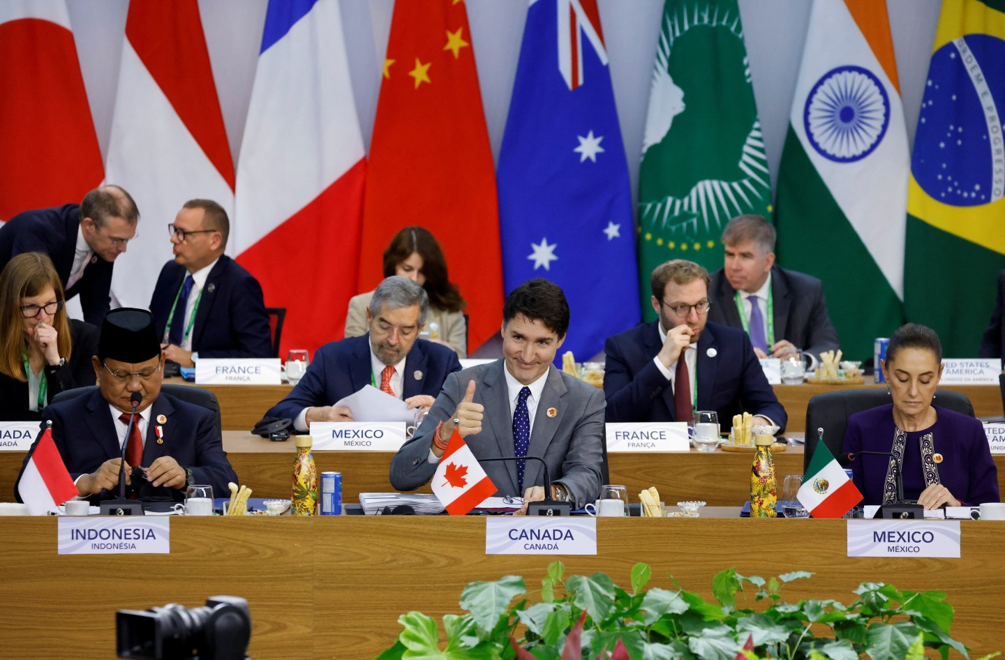 (L to R, first row) Indonesia's President Prabowo Subianto, Canada's Prime Minister Justin Trudeau, and Mexico's President Claudia Sheinbaum attend the opening session of the G20 Summit in Rio de Janeiro, on Nov. 18, 2024.