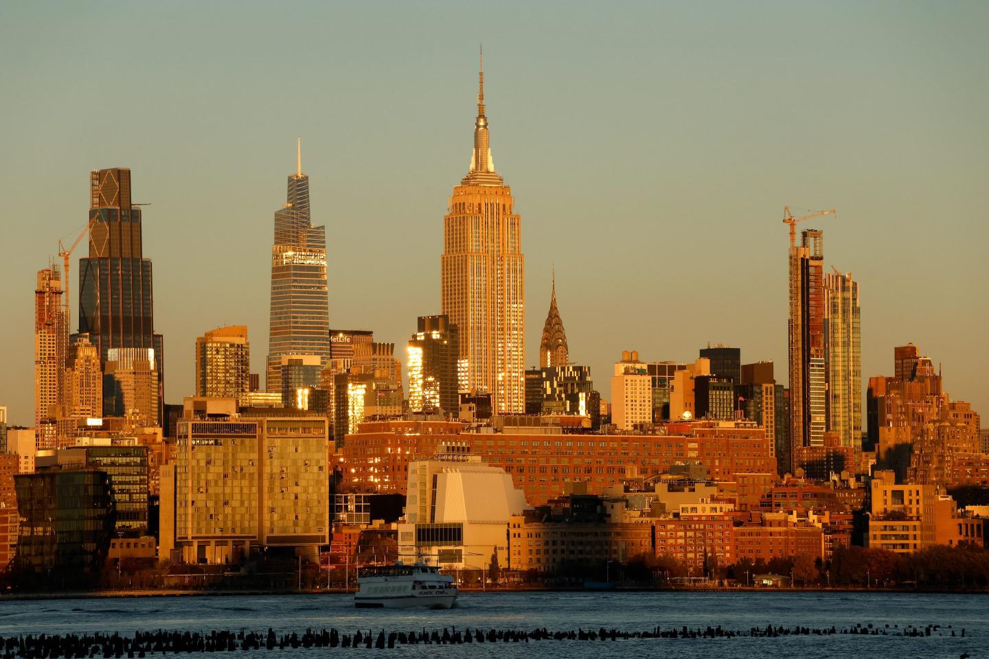 The sun sets on the skyline of midtown Manhattan.