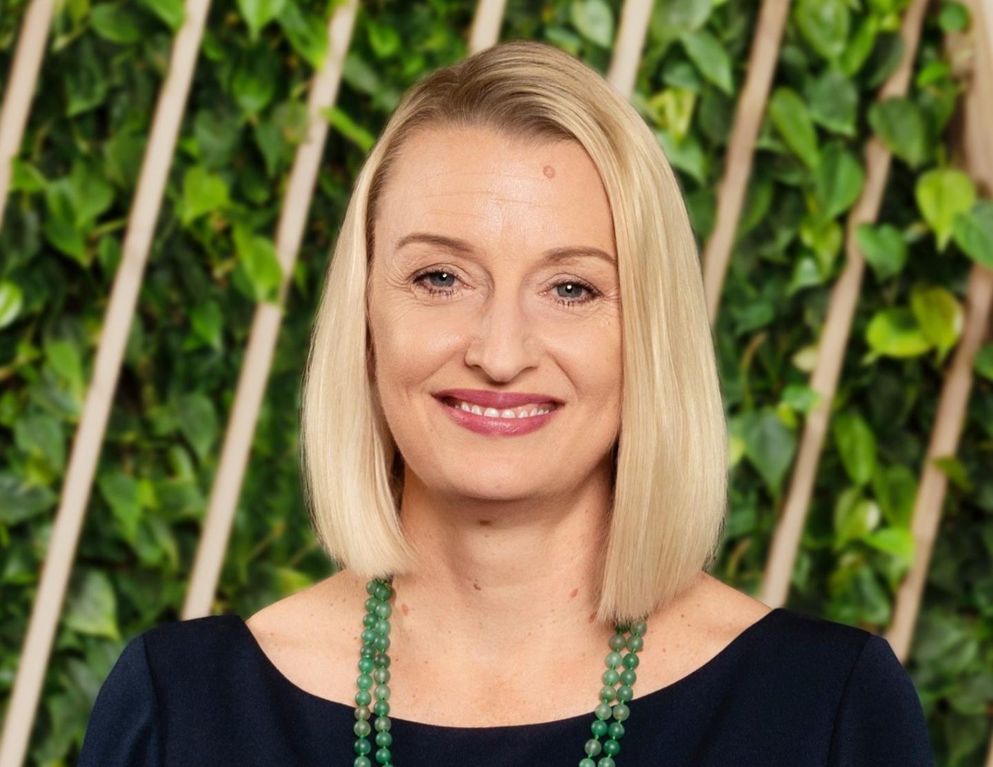 blonde businesswoman smiling for a portrait
