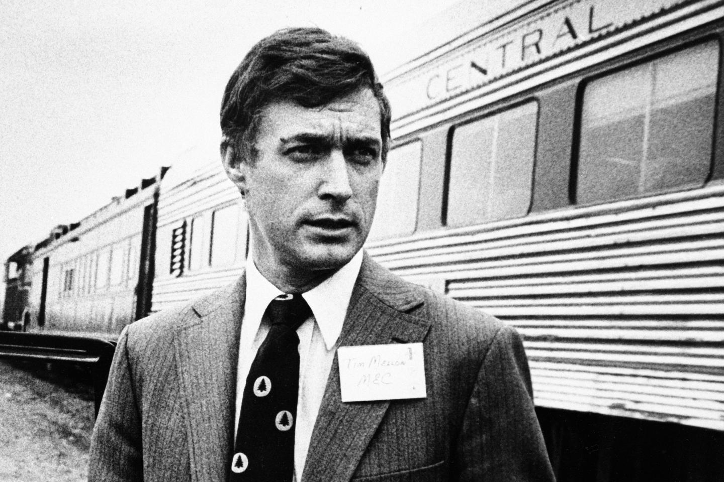 Timothy Mellon standing next to a train