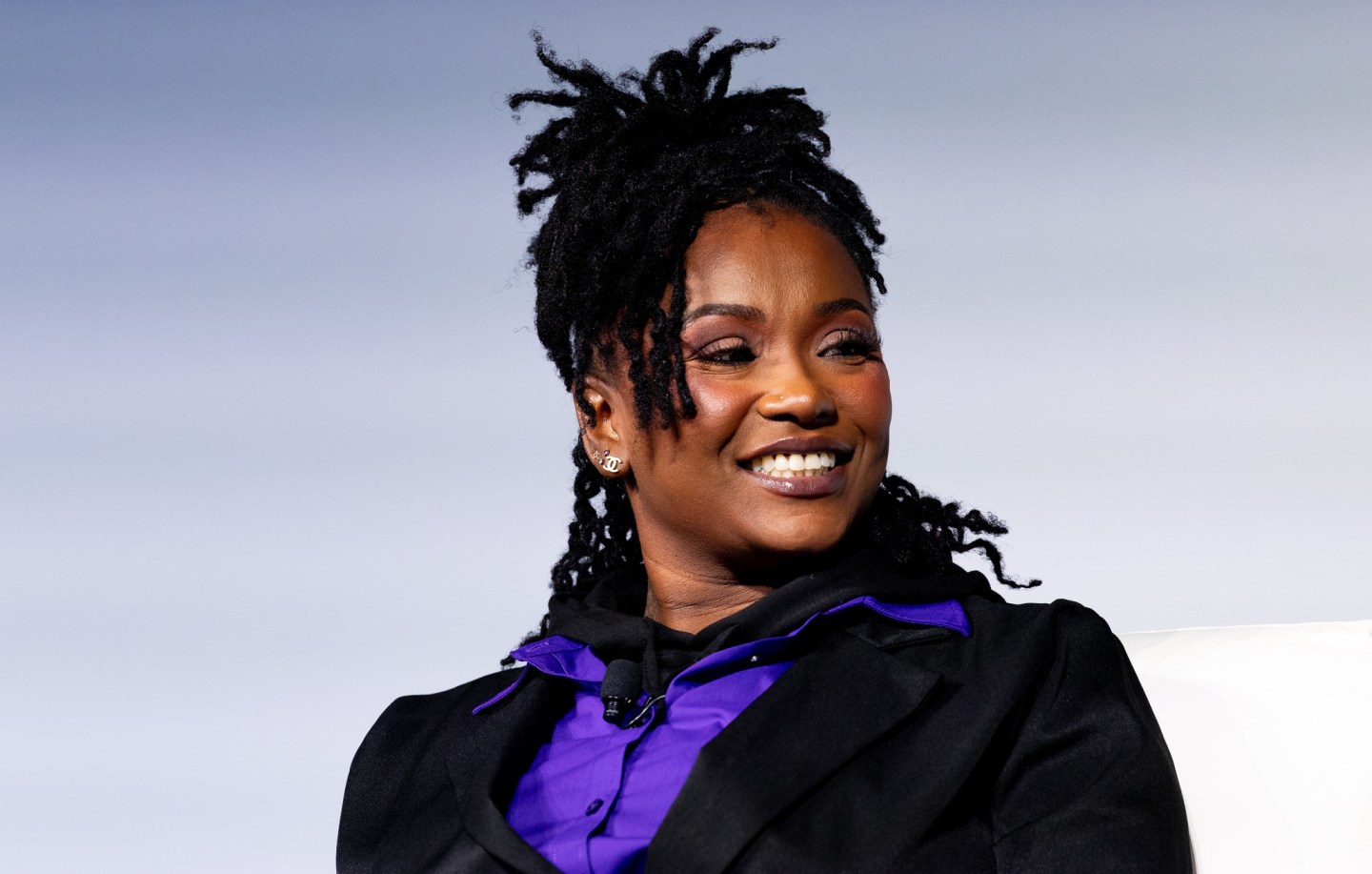 businesswoman smiling on stage