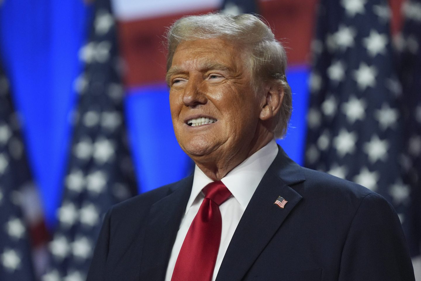 Then-Republican presidential nominee former President Donald Trump smiles at an election night watch party at the Palm Beach Convention Center, Nov. 6, 2024, in West Palm Beach, Fla.
