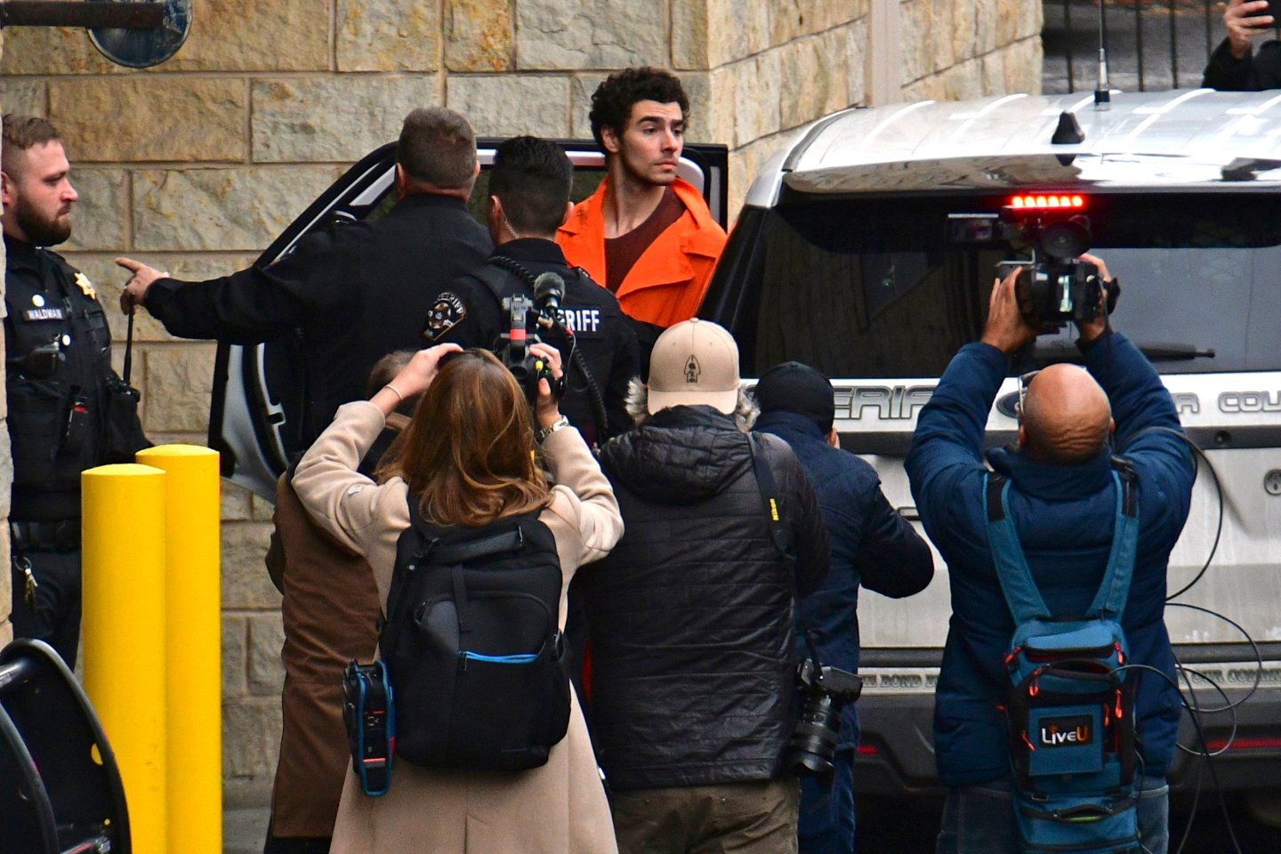 Suspect Luigi Mangione is taken into the Blair County Courthouse on Dec. 10, 2024, in Hollidaysburg, Pa.
