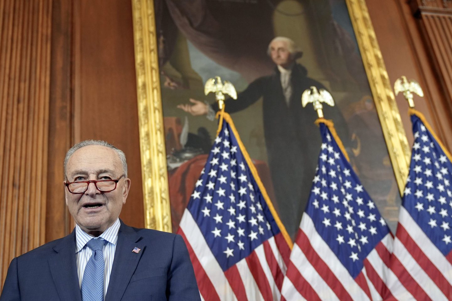Senate Majority Leader Chuck Schumer, D-N.Y., prays during a U.S. Capitol Hanukkah event with a ceremonial Menorah lighting to commemorate the upcoming eight-day festival of Hanukkah on Capitol Hill on, Dec. 17, 2024, in Washington.