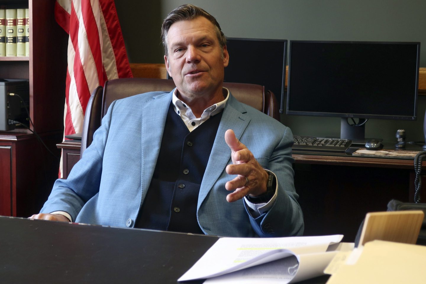 Kansas Attorney General Kris Kobach, who's informally advising President-elect Donald Trump's transition team, discusses immigration issues during an interview with The Associated Press, on Dec. 18, 2024, in his office in Topeka, Kan.