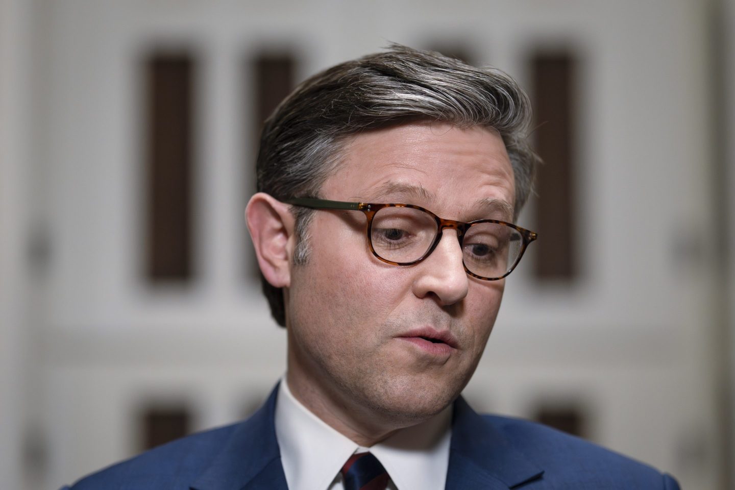 Speaker of the House Mike Johnson, R-La., talks briefly to reporters just before a vote on an interim spending bill to prevent a government shutdown, at the Capitol in Washington, on Dec. 19, 2024.