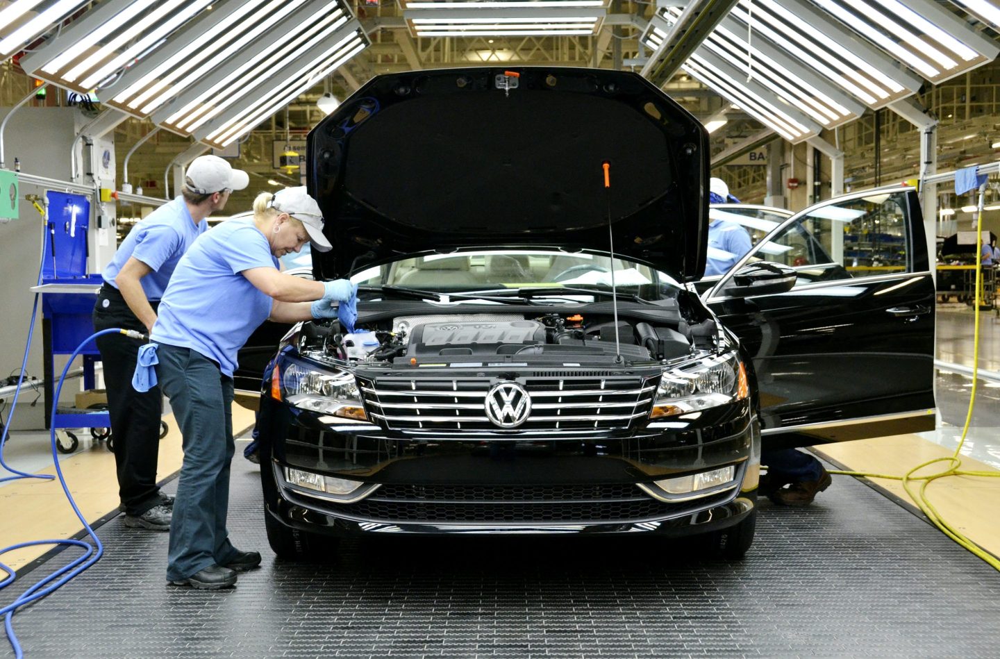 Line inspection workers check out a Volkswagen AG 2012 Passat at the company's factory in Chattanooga, Tennessee, U.S., on Wednesday, June 1, 2011.