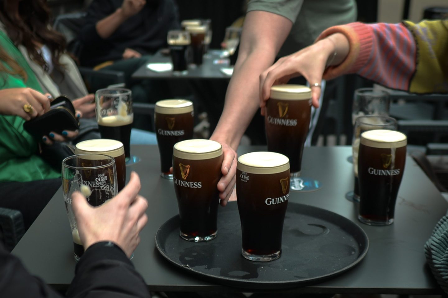 people drinking guinness beer