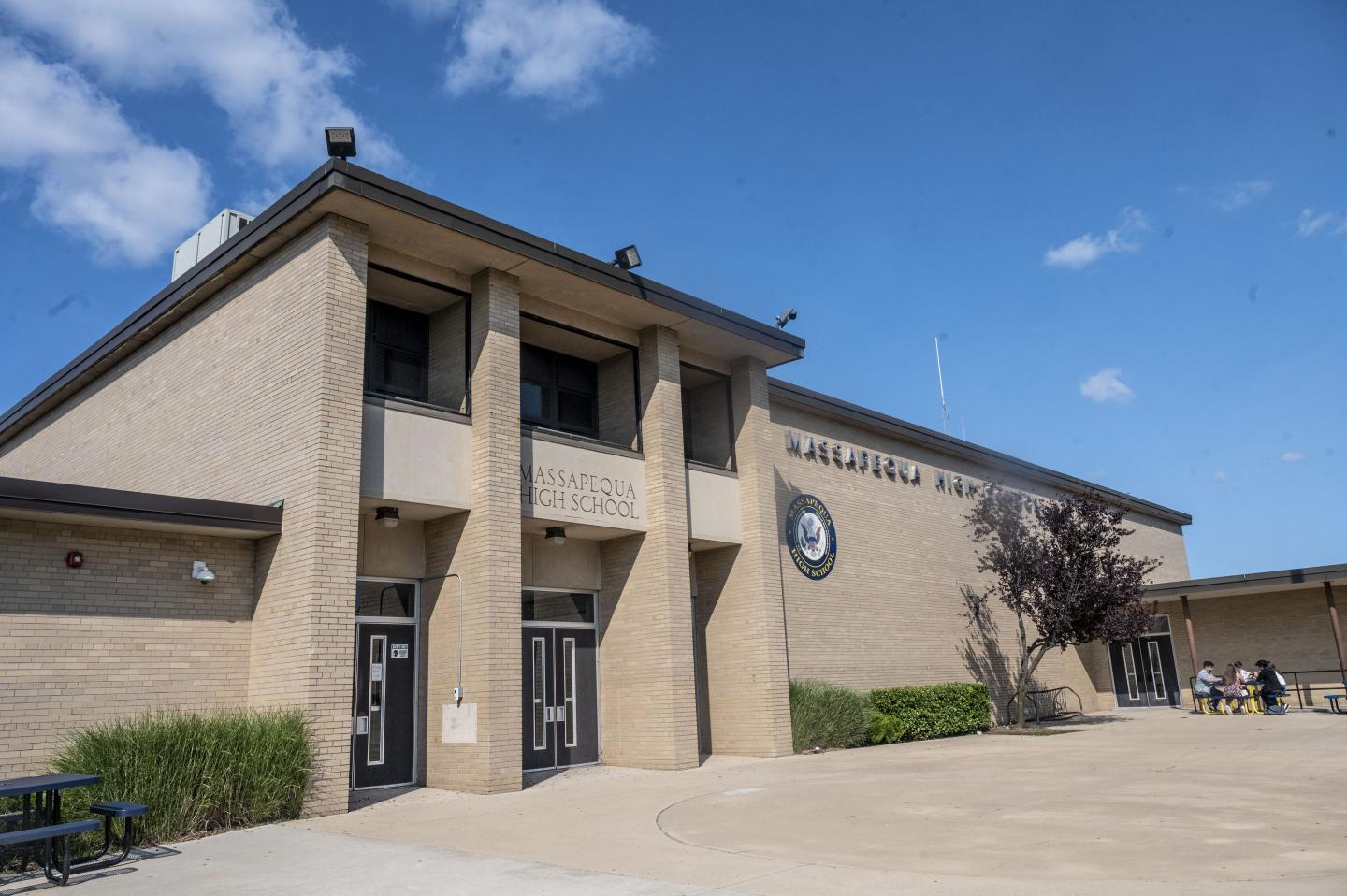 The outside of Massapequa High School on a sunny day
