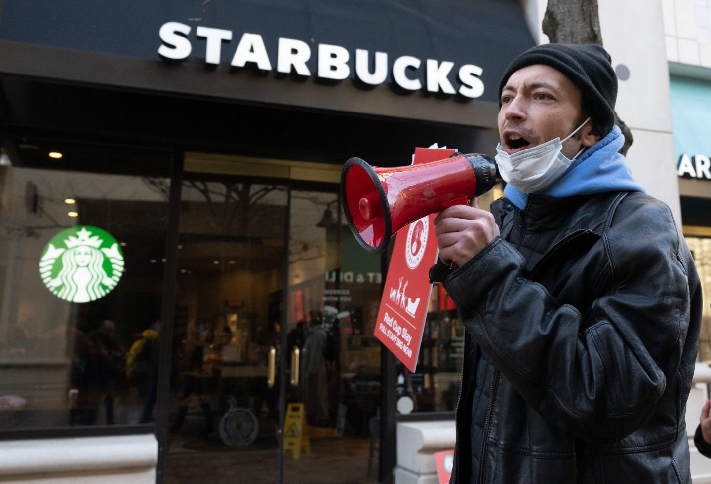Starbucks worker with megaphone