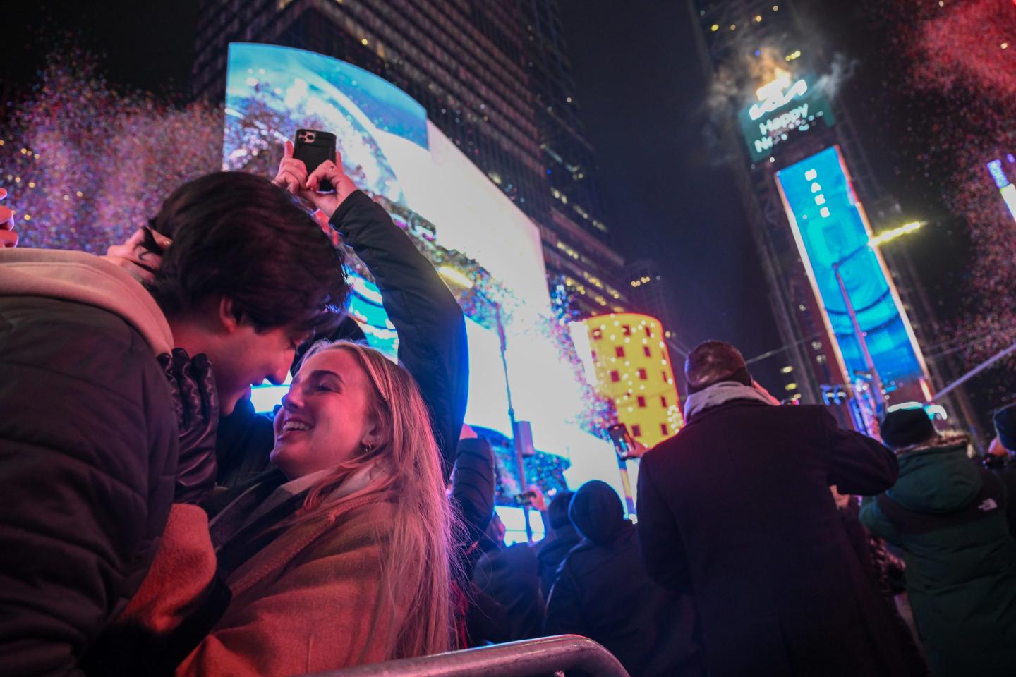 Young couple kissing at midnight in Times Square