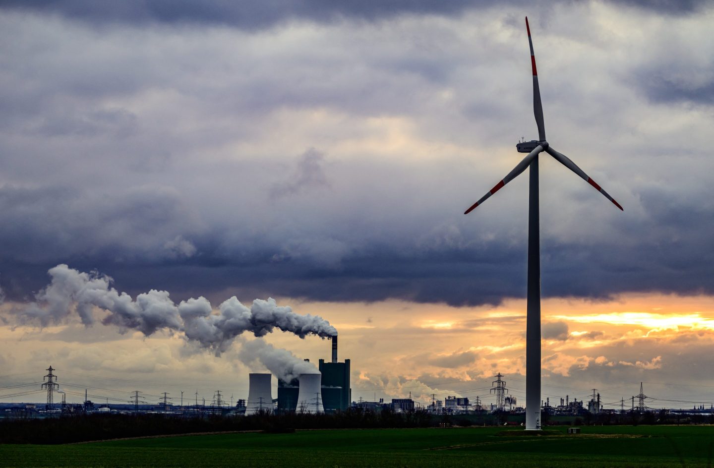 A wind turbine is seen in front of the lignite-fuelled Schkopau power plant south of Halle on January 4, 2024.