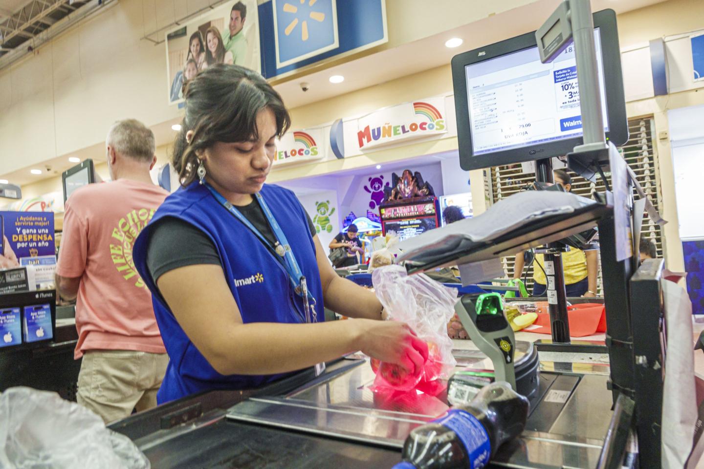 Walmart employee at check out