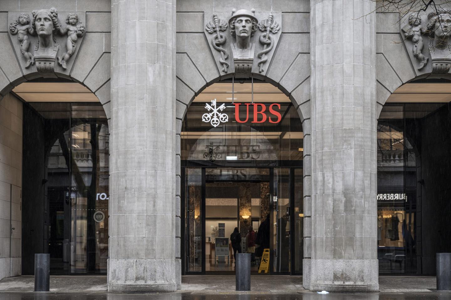 A logo above the entrance to the UBS Group AG headquarters in Zurich.