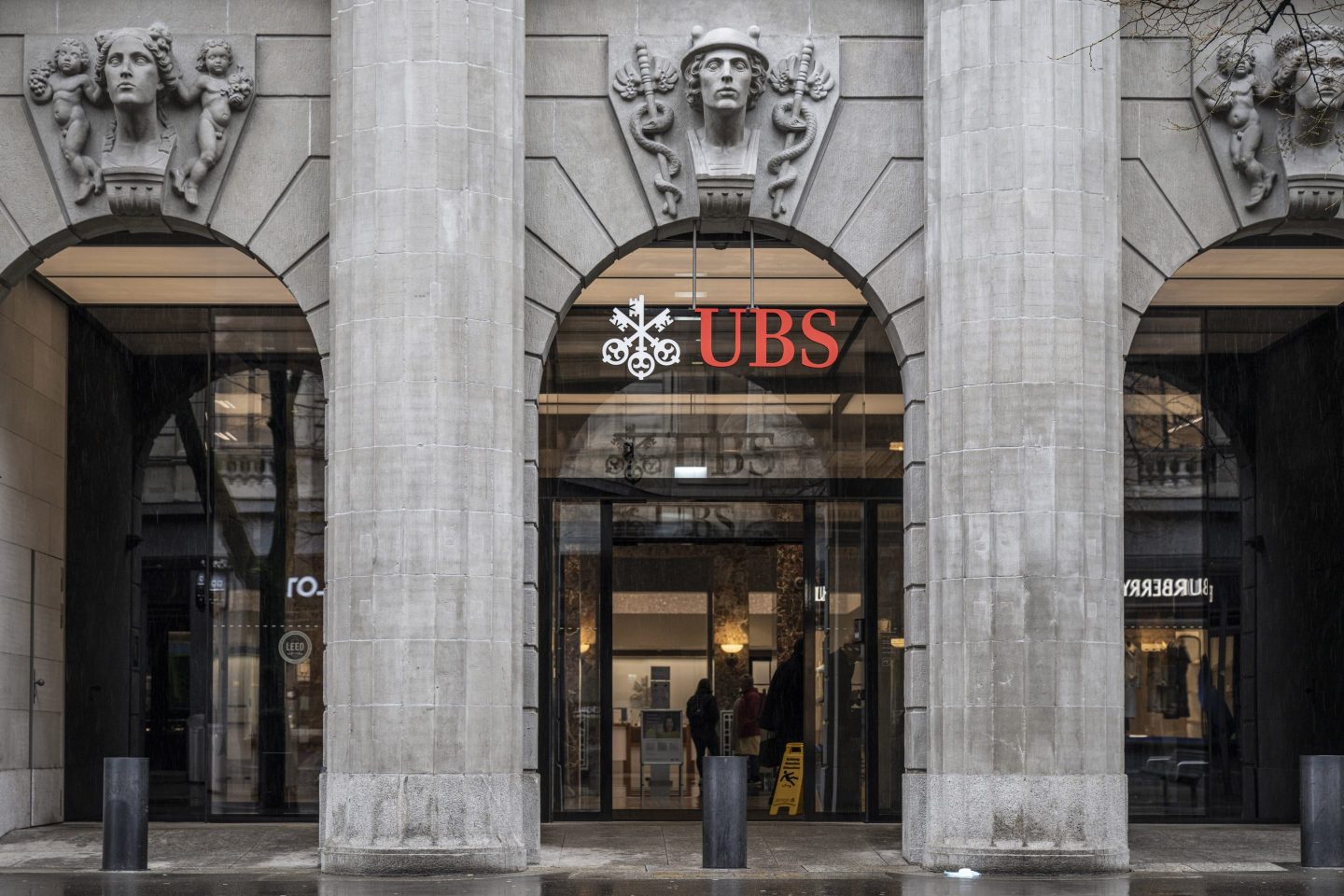 A logo above the entrance to the UBS Group AG headquarters in Zurich.