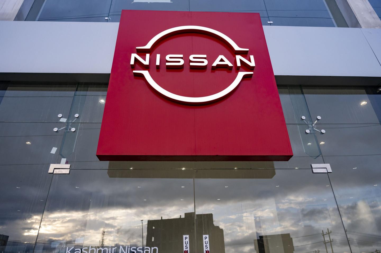 A Nissan logo is seen displayed outside a Nissan Showroom in