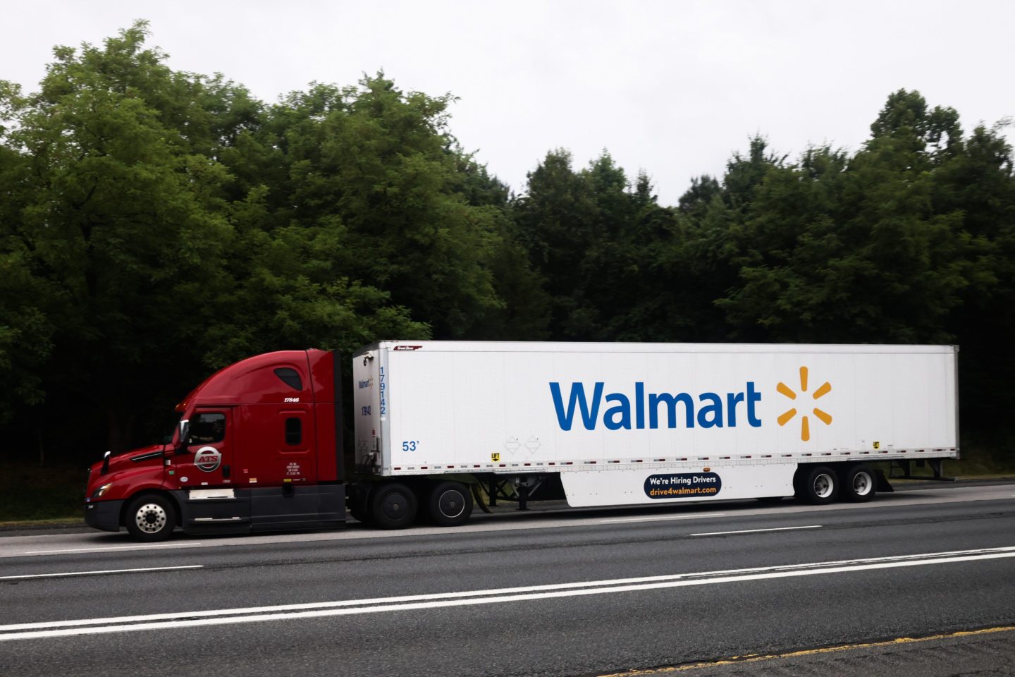 Walmart logo is seen on a truck semitrailer