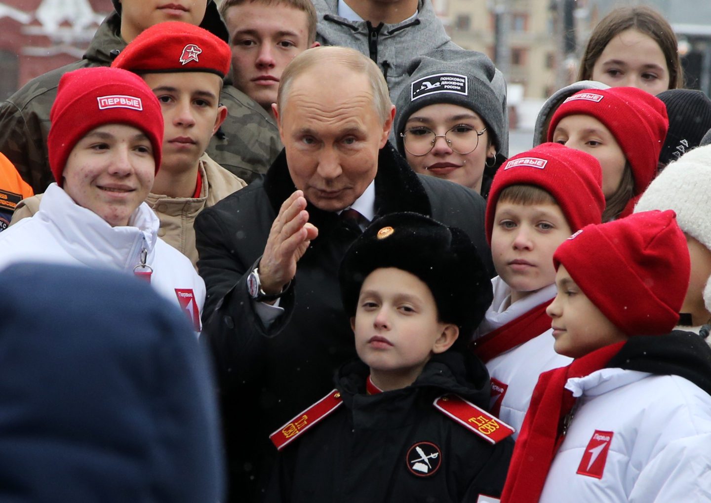 Vladimir Putin poses with the children of Russian officers in Moscow on Nov. 4.