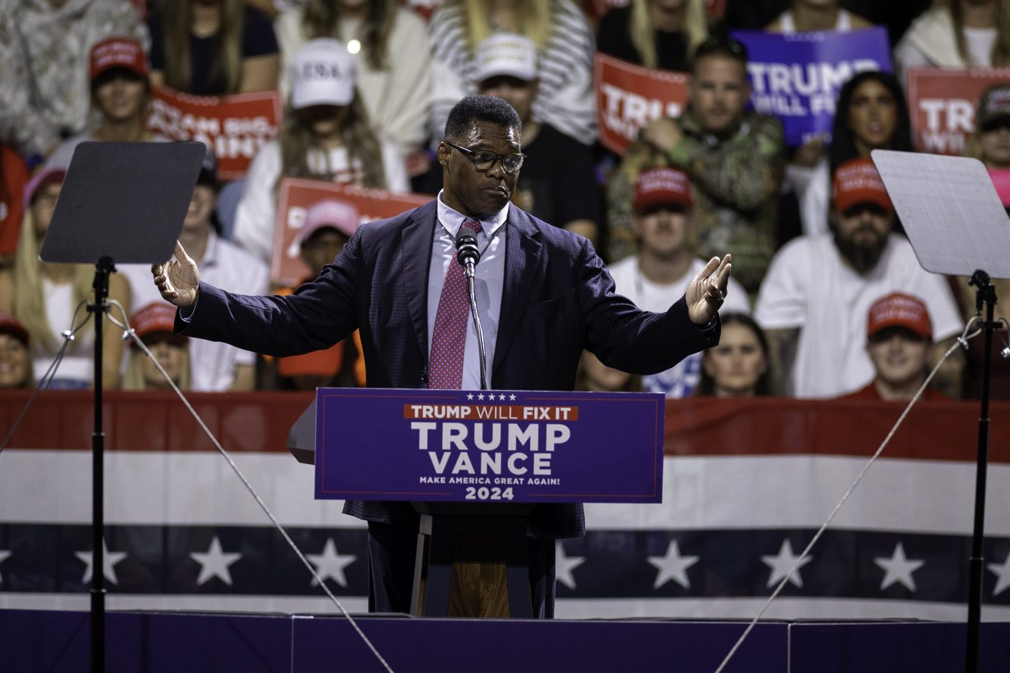 Former NFL running back and former Republican candidate for U.S. Senate Herschel Walker addresses the crowd at a rally for Republican presidential candidate and former President Donald Trump at the Atrium Health Ampitheater on Nov. 3, 2024 in Macon, Ga.