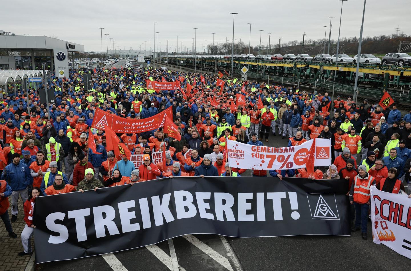 Volkswagen workers walk out on strike as German auto industry is engulfed in crisis