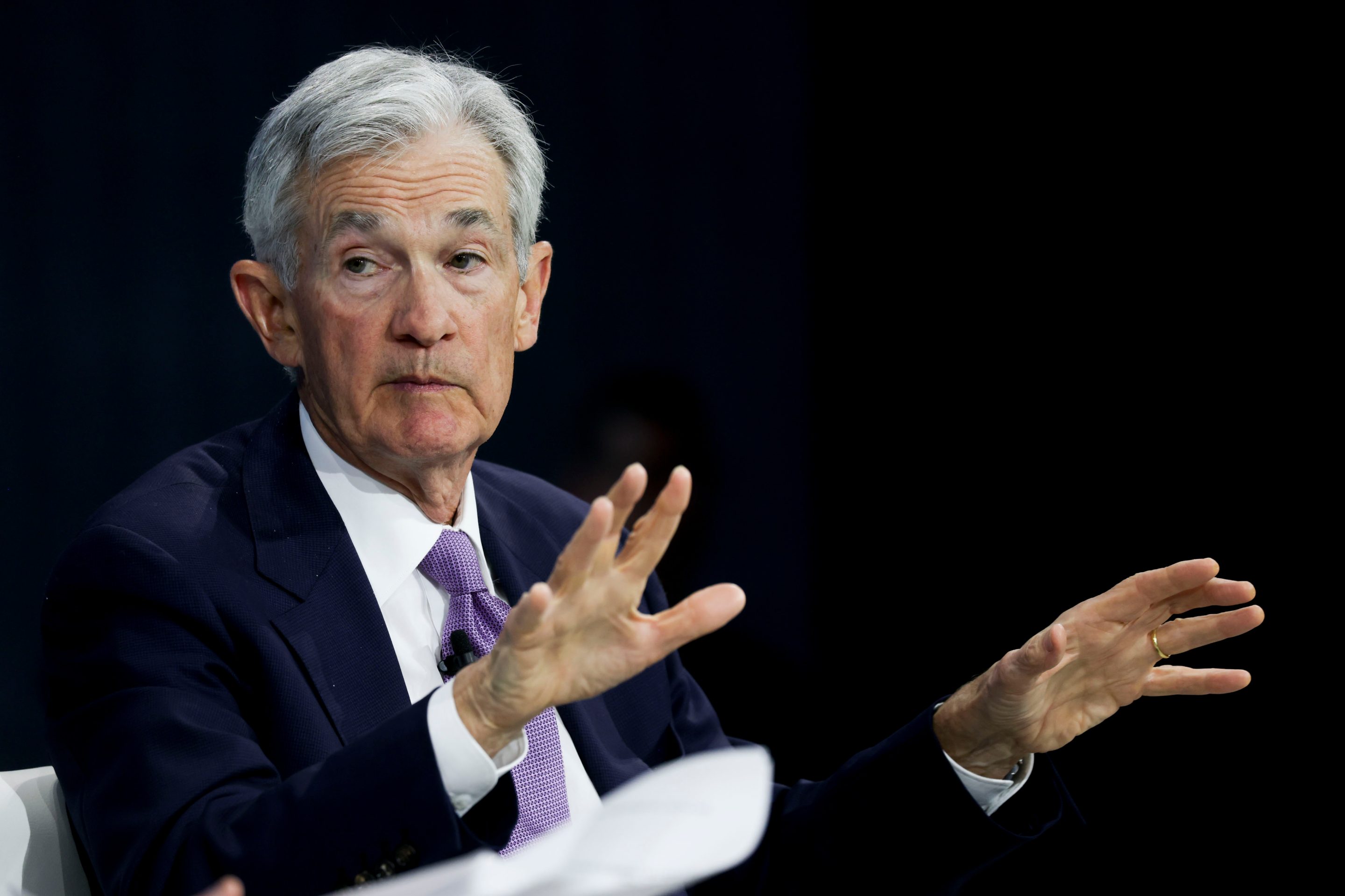 Jay Powell holds up his hands while sitting in a 1:1 discussion at the NYT Dealbook Summit