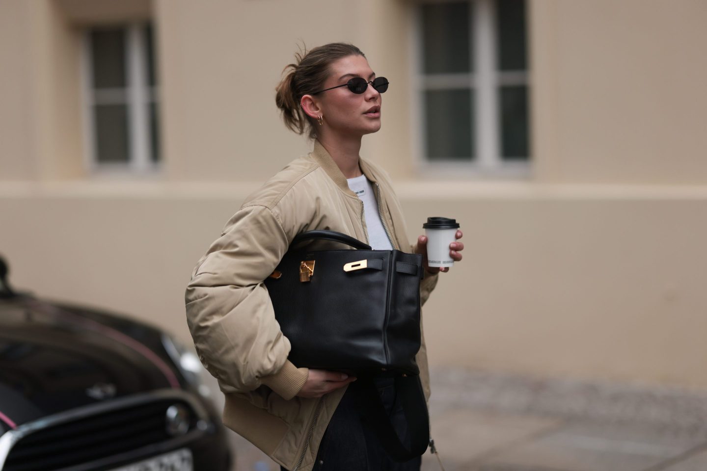 Sophia Geiss holds a black leather “Kelly” bag from Hermès on Dec. 11, 2024 in Berlin. Holt Renfrew CEO Sebastian Picardo credits brands like Hermès with managing for the long term.