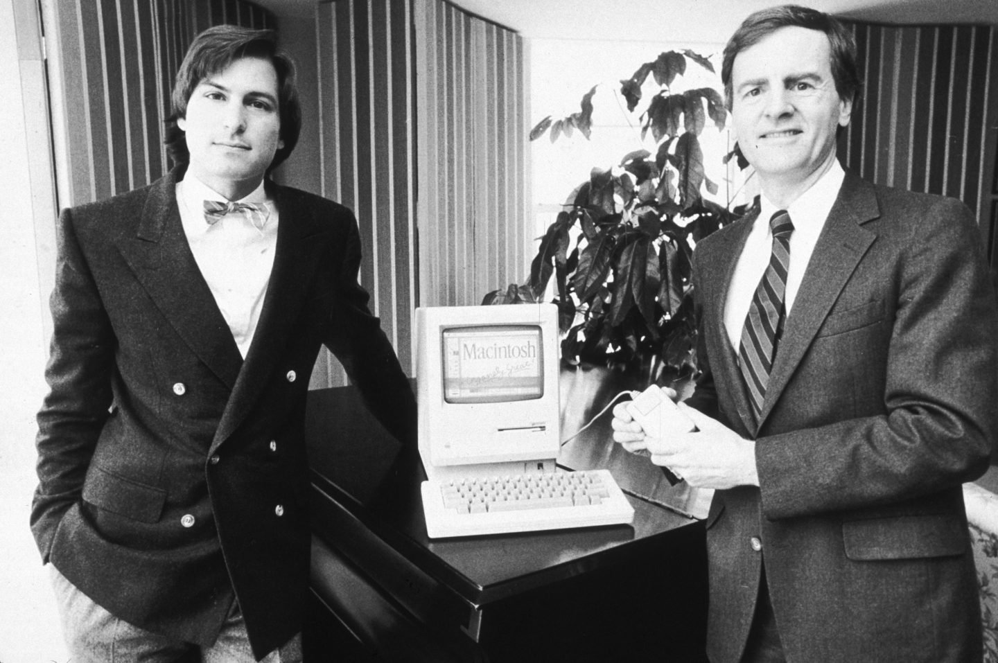 Steve Jobs, then-chairman of Apple Computers, and John Sculley, then-Apple's president, pose with the new Macintosh personal computer, New York City in January 1984.